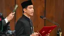 Dalam sumpahnya, Presiden dan Wakil Presiden periode 2024-2029 Prabowo Subianto dan Gibran Rakabuming Raka mengucapkan janji untuk memegang teguh Undang Undang Dasar. (BAY ISMOYO/AFP)