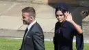 <p>Istri mantan pemain sepak bola Inggris David Beckham, Victoria Beckham melambaikan tangan saat menghadiri pernikahan Pangeran Harry dan Meghan Markle di St. George's Chapel, Kastil Windsor, Inggris, Sabtu (19/5). (ANDREW MILLIGAN/POOL/AFP)</p>