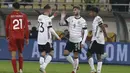 Tiga menit berselang, Timo Werner mencetak gol keduanya untuk membawa Jerman unggul 3-0. Usai menerima umpan dari Florian Wirtz, ia langsung melepaskan tendangan melengkung kaki kanan ke arah tiang jauh yang gagal diantispasi Stole Dimitrievski. (AP/Boris Grdanoski)