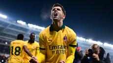 Pemain AC Milan, Christian Pulisic, melakukan selebrasi setelah mencetak gol ke gawang Torino pada laga pekan ke-14 Serie A 2025/2026 di Olimpico Grande Torino pada Selasa (9/12/2025). (AFP/Marco Bertorello)