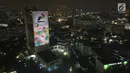 Foto aerial video mapping atau layar bergerak yang bertema Asian Games di Gedung Utama Pertamina, Jakarta, Kamis (5/7). (Liputan6.com/Arya Manggala)