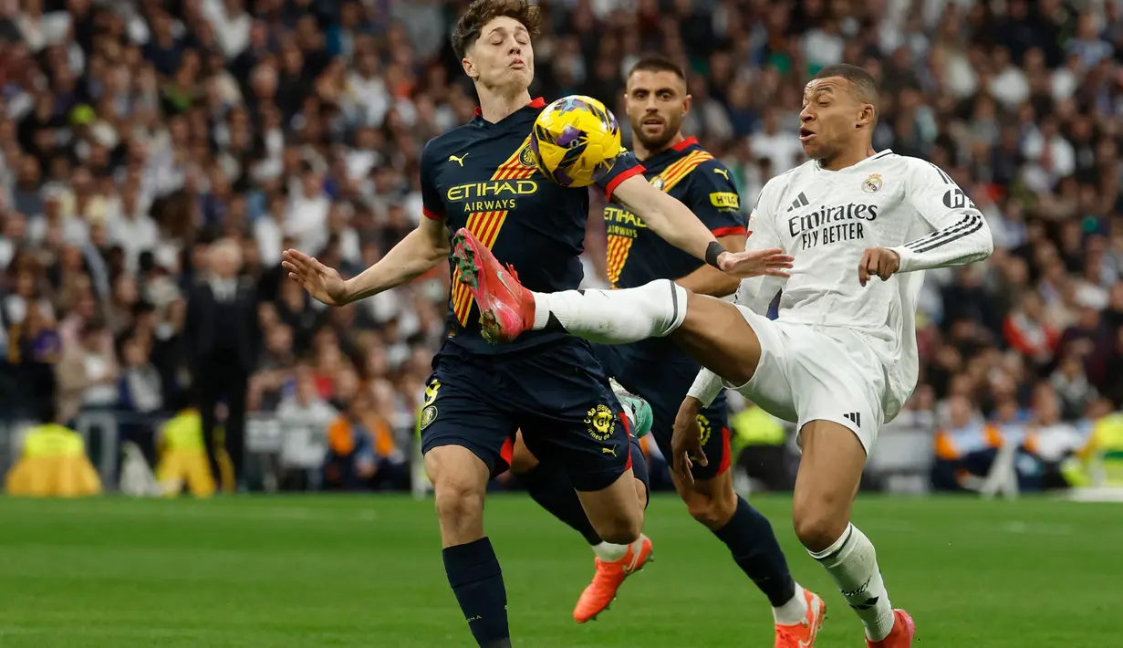 Keunggulan 1-0 Real Madrid atas Girona bertahan hingga waktu turun minum. (Pierre-Philippe MARCOU/AFP)