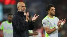 Meski masih tersisa satu pertandingan di Liga Inggris, skuad asuhan Pep Guardiola tak akan mampu menyusul raihan poin Arsenal. Mereka terpaut empat poin di klasemen sementara. (AP Photo/Ian Walton)