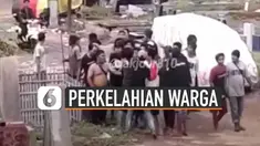 Beredar video aksi perkelahian warga. Seseorang terlihat membawa senjata api. Kejadian itu juga terjadi di tempat pemakaman umum.