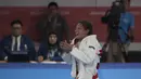 Atlet ju-jitsu Indonesia, Simone Julia, usai melawan atlet Mongolia, Udval Tsogkhuu, pada perebutan perunggu Asian Games XVIII di JCC Senayan, Jakarta, Sabtu (25/8/2018). Kalah, dirinya gagal mendapatkan medali. (Bola.com/Vitalis Yogi Trisna)