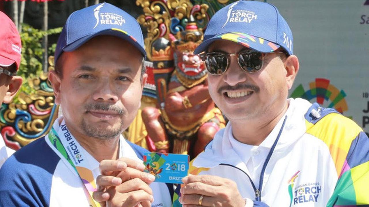 Komisaris Utama Bank BRI Bawa Obor Asian Games 2018 Menuju Lapangan Puputan Renon