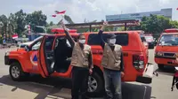 Pelepasan 55 relawan dalam Gerakan Mobil Masker untuk Masyarakat di halaman Gedung Is Plaza di bilangan Pramuka, Jakarta Timur, Senin (16/8/2021). (Dok BNPB).