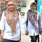 Salah seorang pasien menunjukan dampak signifikan penurunan tubuh dengan pola diet transformasi 90 hari di Garut, Jawa Barat. (Liputan6.com/Jayadi Supriadin)