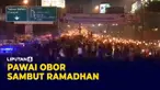 Ribuan warga kawasan Puncak Bogor antusias mengikuti pawai obor untuk sambut datangnya bulan suci ramadhan. Keramaian di jalan ini memicu macet panjang Rabu (30/3) malam.