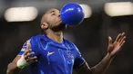 Pemain Chelsea, Christopher Nkunku melakukan selebrasi dengan meniup balon setelah mencetak gol ke gawang Southampton dalam laga lanjutan Liga Inggris 2024/2025 di Stamford Bridge, London, Rabu (26/02/2025) WIB. (AP Photo/John Walton)