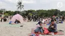 Pihak pengelola Pantai Ancol Taman Impian, Jakarta menargetkan total pengunjung selama libur Lebaran 2025 bisa mencapai 660 ribu orang. (Liputan6.com/Herman Zakharia)