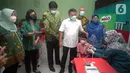 Program percepatan vaksinasi COVID-19 bagi anak usia 6-11 tahun di SDN Jatiasih III, IV dan V Bekasi merupakan kolaborasi Kantor Staf Presiden (KSP) dan Nestlé MILO dengan membagikan 4 juta produk MILO UHT bagi 4.000 Sekolah Dasar di 50 kota di seluruh Indonesia. (Liputan6.com/HO/Milo)