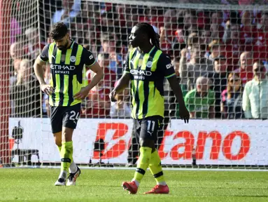 Manchester City harus menelan pil pahit kala bertandang ke markas Nottingham Forest dalam laga pekan ke-28 Premier League 2024/2025 di City Ground, Sabtu (8/3/2025) malam WIB. (AP Photo/Rui Vieira)