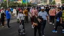 Warga berolahraga saat hari bebas kendaraan atau Car Free Day (CFD) di Jakarta, Minggu (12/5/2024). (Liputan6.com/Angga Yuniar)