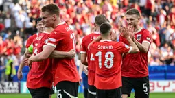 Timnas Austria sukses memetik kemenangan di pertandingan kedua grup D Euro 2024. (Fabrice COFFRINI/AFP)