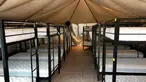 Foto tanpa tanggal menunjukkan tempat tidur untuk menampung anak-anak imigran gelap yang telah terpisah dari orang tuanya di bawah kebijakan “tanpa toleransi” Presiden Donald Trump di Tornillo, Texas. (HHS' Administration for Children and Families via AP)