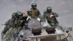 Prajurit naik di atas APC selama fase aktif pelatihan bersama "Indestructible Brotherhood-2023" dengan Pasukan Penjaga Perdamaian dari Organisasi Perjanjian Keamanan Kolektif atau Collective Security Treaty Organization (CSTO) di tempat latihan "Edelweiss" di Balykchy, sebuah kota dekat Danau Issyk-Kul sekitar 180 km tenggara dari Bishkek, Kyrgyzstan, Rabu (11/10/2023). (AP Photo/Vladimir Voronin)
