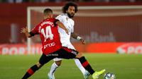 Bek Real Madrid, Marcelo, saat menghadapi Real Mallorca di Iberostar Estadi pada laga pekan kesembilan La Liga Spanyol, Sabtu (19/10/2019). (AFP/Jaime Reina)