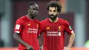 Pasangan Mohamed Salah dan Sadio Mane merupakan duet yang berhasil mengantarkan Liverpool menyabet gelar Liga Inggris musim 2019/2020. Mereka berhasil menjadi penyerang yang tajam dengan torehan 30 gol untuk The Reds pada musim tersebut. (Foto: AFP/Karim Jaafar)
