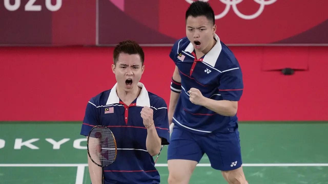 Foto: Angkat Koper dari Olimpiade Tokyo 2020, Pasangan Marcus/Kevin Dipaksa Tunduk oleh Pasangan Malaysia di Babak 16 Besar