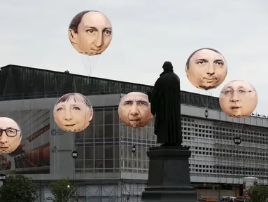 Balon yang menggambarkan wajah pemimpin negara anggota G7 menghiasi kota Dresden, Jerman, (27/5/2015). Kanselir Jerman Angela Merkel mengatakan, tak terbayangkan bila Rusia berpartisipasi dalam pertemuan G7. (REUTERS/Fabrizio Bensch)