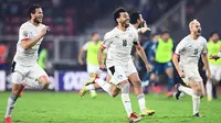 Timnas Mesir berhasil lolos ke final Piala Afrika 2021 setelah mengalahkan Kamerun lewat adu penalti dengan skor 3-1 di Olembe Stadium, Yaounde, Jumat (4/2/2022) dini hari WIB. (AFP/CHARLY TRIBALLEAU)