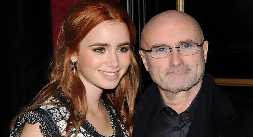 Phil Collins bersama putrinya, Lily Collins. (The Sun)