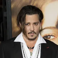 Siapa sangka di balik kerennya Johnny Depp ternyata ia gemar bermain dengan boneka Barbie? (AFP/Bintang.com)
