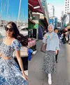 Kemeja dan rok asimetris dengan motif bunga senada ala Pamela Bowie bisa jadi pilihan untuk outfit ke pantai. [Foto: IG/pammybowie].