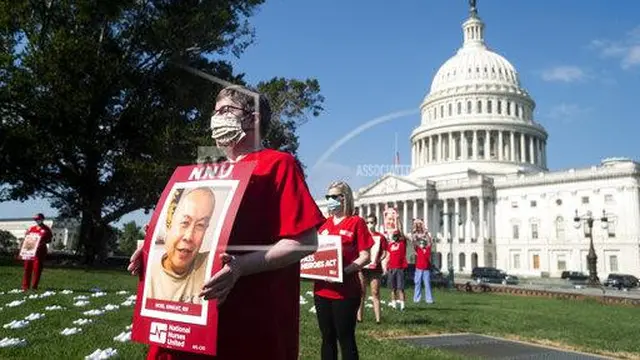 NATIONAL NURSES UNITED (Bill Clark/AP Images)