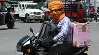 Sebuah penelitian ilmiah ekstensif menemukan bahwa perubahan iklim menyebabkan gelombang panas menjadi lebih lama, lebih sering dan lebih intens. (Narinder NANU/AFP)