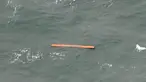 Sebuah benda diduga serpihan badan pesawat ditemukan di sekitar Pulau Tujuh di Kepulauan Bangka Belitung, Selasa (30/12/2014). (AFP PHOTO/Bay ISMOYO)