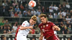 Bayern Muncih gagal berikan kemenangan di laga pembuka Liga Jerman usai ditahan imbang oleh Moenchengladbach. Tuan rumah mampu merepotkan juara bertahan Liga Jerman musim 2020/2021. (Foto: AFP/Ina Fassbender)