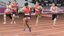 Purnomo Sapto Yogo pelari Indonesia meraih medali emas di nomor 100 meter putra klasifikasi T37 pada Asian Para Games 2018, di Stadion Utama Gelora Bung Karno Jakarta, Selasa (9/10/2018).  (Bola.com/Peksi Cahyo)