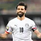 Mohamed Salah berhasil menjadi penentu kemenangan Mesir saat menumbangkan Pantai Gading di babak 16 besar Piala Afrika 2021 yang berlangsung di Stade Omnisport de Douala, Rabu (26/1/2022) malam WIB. (AFP/Charly Triballeau)