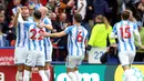 Laurent Depoitre bersama pemain Huddersfield lainnya merakan gol kedua saat melawan Manchester United dalam Liga Inggris di stadion John Smith di Huddersfield (21/10). Depoitre berhasil menyumbang satu gol untuk Huddersfield. (Nigel French / PA via AP)