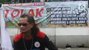 Penolakan program Tabungan Perumahan Rakyat (Tapera). Buruh saat mengikuti aksi unjuk rasa di kawasan Patung Kuda, Jakarta, Kamis (6/6/2024). Aksi ratusan buruh tersebut menolak program Tabungan Perumahan Rakyat (Tapera). (Liputan6.com/Angga Yuniar)