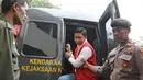 Komisaris First Travel Kiki Hasibuan tiba di Pengadilan Negeri Depok, Jawa Barat, Senin (21/5). Majelis hakim memutuskan melanjutkan sidang bos First Travel dengan agenda pembacaan putusan pada Rabu (30/5/2018). (Liputan6.com/Herman Zakharia)