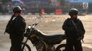 Polisi bersenjata bersiaga dalam apel pengamanan Asian Games 2018 di Lapangan Ditlantas Polda Metro Jaya, Jakarta, Selasa (31/7). (Merdeka.com/Imam Buhori)