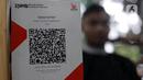 Dengan QRIS, pelanggan dapat membayar langsung menggunakan dompet digital yang terhubung dengan kode QR yang dihasilkan oleh pedagang atau penyedia jasa. (Liputan6.com/Johan Tallo)