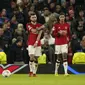 Reaksi para pemain Manchester United setelah penyerang Bayern Munchen Kingsley Coman mencetak gol pembuka timnya pada laga matchday 6 yang dihelat di Old Trafford, Rabu (13/12/2023) dini hari WIB.  (AP Photo/Dave Thompson)