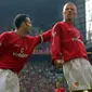 Dua mantan pemain Manchester United, Ryan Giggs dan David Beckham. (AFP/Odd Andersen)