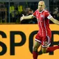Arjen Robben melakukan selebrasi usai mencetak gol ke gawang Borussia Dortmund pada pertandingan Bundesliga Jerman di Dortmund, (4/11). Munchen memuncaki klasemen dengan 26 poin, unggul empat poin dari RB Leipzig. (AP Photo / Martin Meissner)
