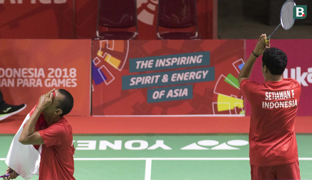 Fredy Setiawan/Dwiyoko pebulutangkis Indonesia meraih medali emas di nomor ganda putra SL3-SL4 setelah mengalahkan pasangan Korea pada Asian Para Games 2018 di Istora Senayan, Sabtu (13/10/2018).  (Bola.com/Peksi Cahyo)