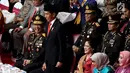 Presiden Joko Widodo atau Jokowi saat menjadi inspektur upacara pada peringatan HUT ke-72 Bhayangkara di Istora Senayan, Jakarta, Rabu (11/7). Jokowi meminta personel Polri terus meningkatkan kinerja. (Liputan6.com/JohanTallo)