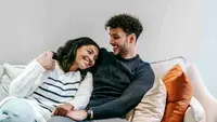 Happy Couple/copyright Pexels.com https://www.pexels.com/photo/smiling-multiracial-couple-hugging-on-couch-6392957/