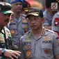 Kapolri Jenderal Tito Karnavian dan Panglima TNI Marsekal Hadi Tjahjanto menghadiri apel Pengamanan Penyelenggara Pemilu 2019 di Lapangan Monas, Jakarta, Selasa (18/9). Pengamanan pemilu ini diberi nama sandi “Mantap Brata” 2018. (Merdeka.com/Imam Buhori)