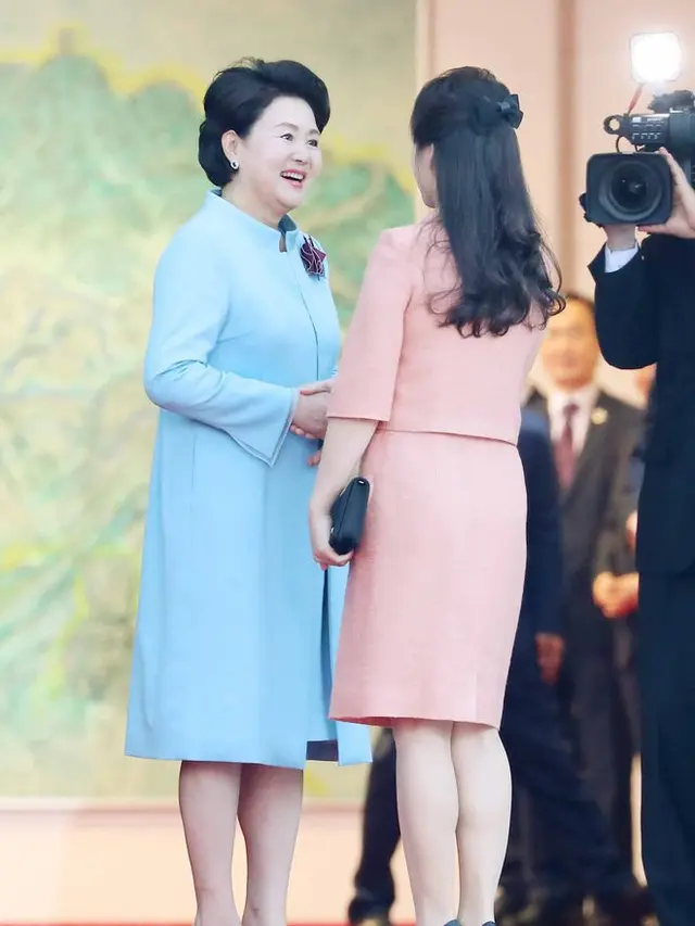 Kim Jong-un dan Ri Sol-ju (Foto: AFP)