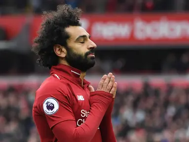 Gelandang Liverpool Mohamed Salah berselebrasi usai mencetak gol ke gawang Chelsea dalam lanjutan Liga Inggris di Stadion Anfield, Liverpool, Inggris, 14 April 2019. Pamain asal Mesir ini akan membela Liverpool menghadapi Tottenham Hotspur di final Liga Champions 2019. (Photo by Paul ELLIS/AFP)