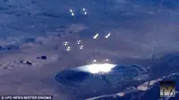 Penampakan cakram raksasa berpijarkan bola cahaya di dekat Area 21. (foto: UFO News)